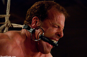 Three doms use and abuse Derek Pain during a live shoot. by Bound Gods image 4