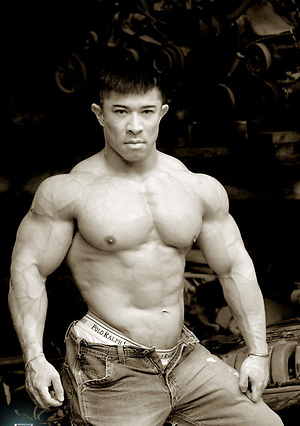Muscled asian man Daryl Gee posing