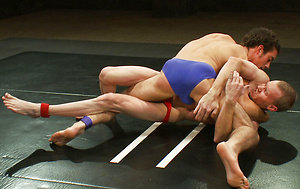 Two crazy ripped studs battle it out on the mat to save their hot asses from getting pounded by the winner\\\'s huge cock. by Naked Kombat image 2