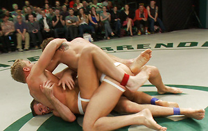 Four big dicked muscle studs fight it out to win the right to humiliate and fuck the losers in front of a live crowd in this brutal tag team match. by Naked Kombat image 3