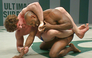 Two big-dicked muscle gods tear it up on the mat and then fuck it out by Naked Kombat image 5