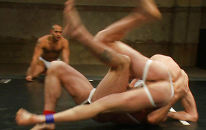 In this brutally hot tag team match four testosterone filled men tear each other up on the mat then fuck and suck like animals to claim their victory. by Naked Kombat image 4