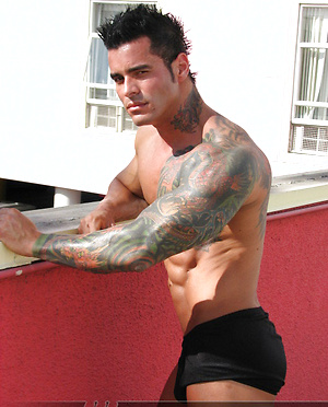 Jock poses outside and jerks off on bed by Mark Wolff image 1
