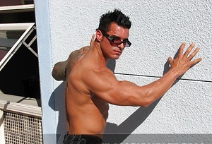 Jock poses outside and jerks off on bed by Mark Wolff image 4