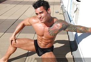 Jock poses outside and jerks off on bed