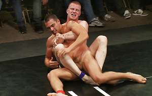 Four hot studs wrestle in an epic tag team match in front of a live audience. The extreme action continues through the explosive suck and fuck finale. by Naked Kombat image 9