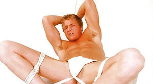 Bounded muscle jock jacking off his uncut dick by Bound Jocks image 10