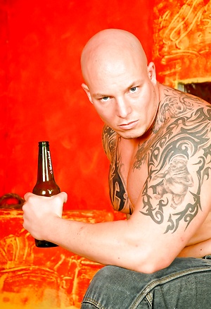 Tattooed bald muscle man Devil