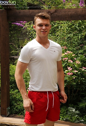 Hard bodied Justin Lovers strokes his cock outdoors. by BoyFun image 1