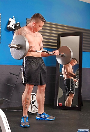 MUscle athlete Slate Steele strokes dick in a gym