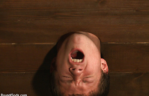Caged sex slave endures a beating, hot wax and hard stockade fuck by Bound Gods image 11