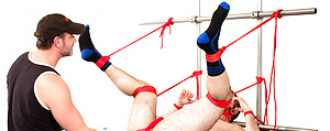 Mr. Kristofer fists Dolan Wolf by Bound Jocks image 7