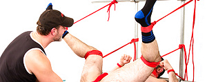 Mr. Kristofer fists Dolan Wolf by Bound Jocks image 11